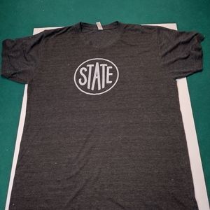 State Dark Gray Single Stich Large USA Give Back Pack on back. In very used con